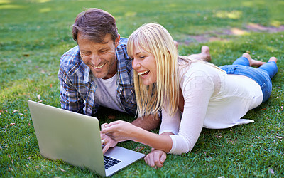 Buy stock photo Love, laugh or couple with laptop in nature for social media, video or streaming comic outdoor Computer, google it or people in backyard online for show search, sign up or netflix and chill on grass