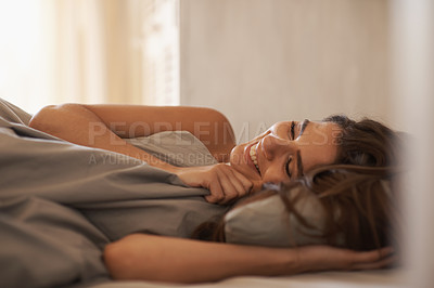 Buy stock photo Relax, happy and woman in bed at her home on weekend morning for calm, rest or sleeping. Confident, smile and young female person laying with duvet blanket in bedroom at apartment in Canada.