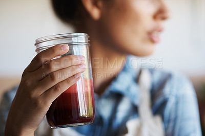 Buy stock photo Glass, hand and smoothie with woman in kitchen of home closeup for diet, health or nutrition. Detox, juice for weight loss and person in apartment with fresh fruit beverage for minerals or vitamins