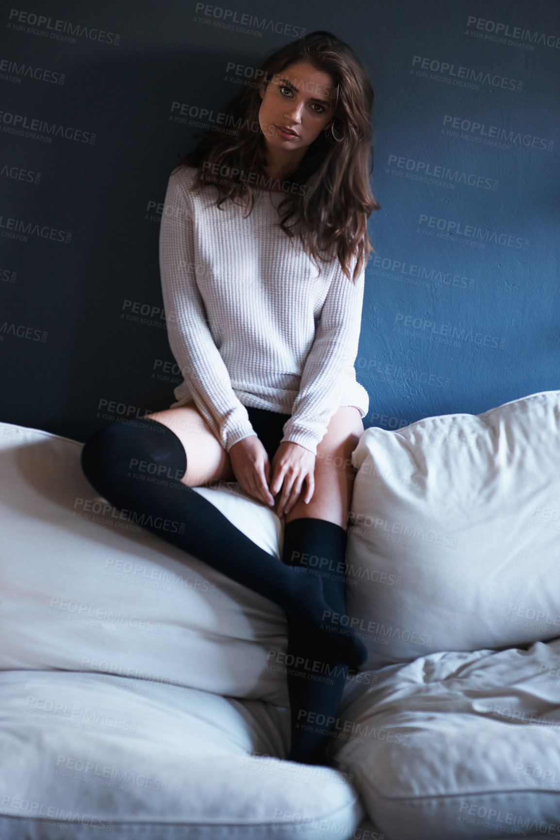 Buy stock photo Fashion, woman and portrait for relax on sofa and alone in home for casual and comfort on weekend with clothes. Young person, serious and body for style, confidence and trend for feminine on couch  