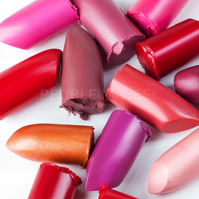 Buy stock photo Shot of lipsticks lying loosely against a white backdrop 
