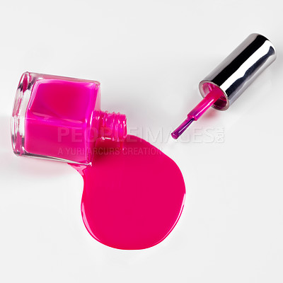 Buy stock photo Nail polish, bottle spill and pink on a white background for beauty, cosmetics and salon products. Cosmetology, spa and isolated liquid, drip and paint for manicure, pedicure and pamper in studio