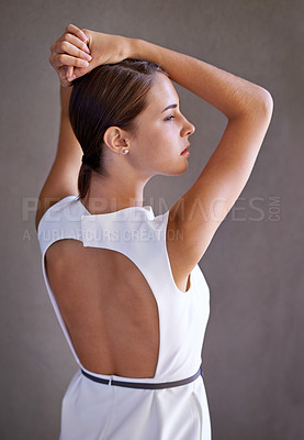 Buy stock photo Elegant dress, fashion and woman in studio, cool or trendy style in gray background. Female model, confidence and proud with pride, standing and stylish or classy outfit or clothes with back view