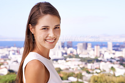 Buy stock photo Woman, smile and portrait in outdoor or city for travel, vacation or view for cityscape and buildings on balcony. Young person, happy and Cape Town with sea and summer for sky on an urban terrace