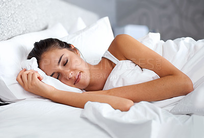 Buy stock photo Cropped shot of a beautiful young woman resting in bed