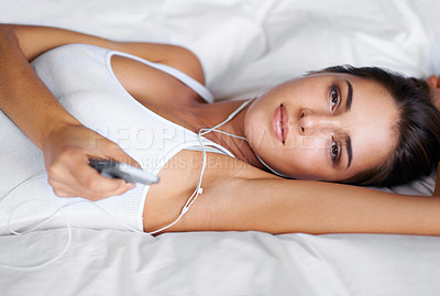Buy stock photo Portrait, listen and music for woman on bed to relax, rest and streaming audio on radio with phone. Digital, technology and podcast for female person in bedroom of apartment, home and mattress