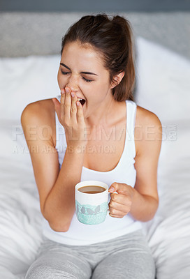 Buy stock photo Woman, fatigue and yawning with tea in bed, waking up from sleeping or nap with morning routine at home. Insomnia, tired and sleepy in bedroom, warm drink or beverage for breakfast and start day