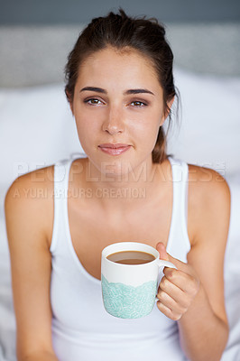 Buy stock photo Woman, coffee and portrait in bed for tired in morning for wakeup and drink in cup for warm and strong with milk. Young person with beverage for caffeine on weekend for boost in mug with pajamas