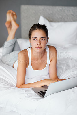 Buy stock photo Woman, lying and laptop on bed in portrait for connection, typing and chatting online to relax. Female person, technology and computer for conversation in casual outfit and comfortable in bedroom