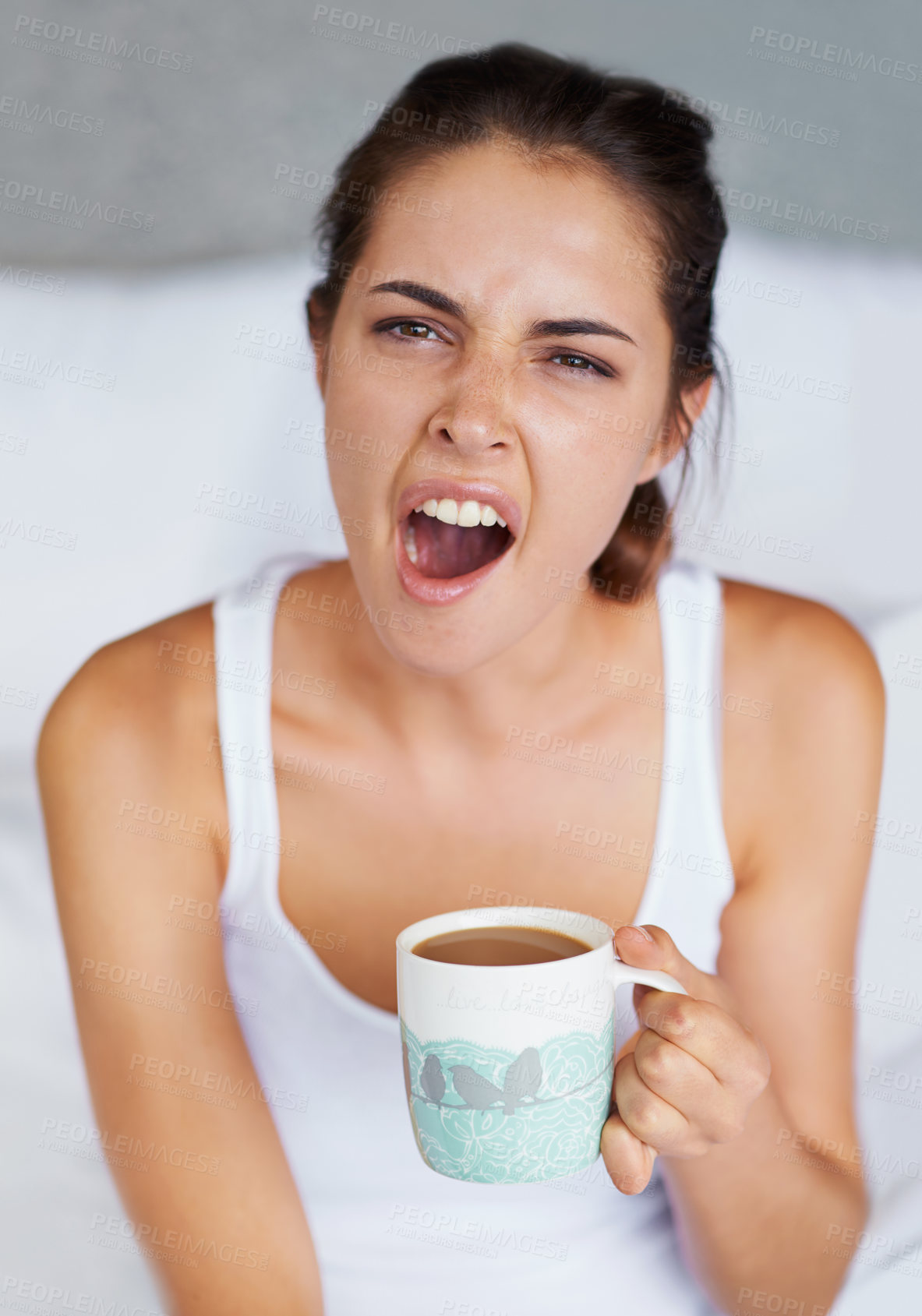 Buy stock photo Woman, tired and yawning with coffee in bed, waking up from sleeping or nap with morning routine at home. Insomnia, fatigue and sleepy in bedroom, warm drink or beverage for breakfast and start day