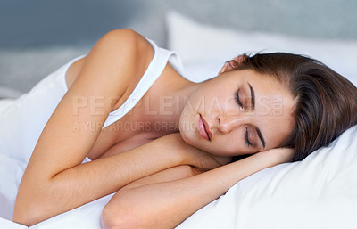 Buy stock photo Bedroom, morning and woman sleeping in bed at house, home and hotel to relax, rest and wake up refreshed in Cape Town. Female person, lady and tired with pillow, blanket and comfortable in nap