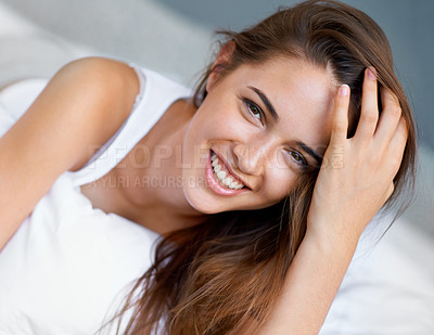 Buy stock photo Smile, relax and portrait of woman in bed with wellness, confidence and happy in apartment. Face, morning and girl in bedroom with peace, calm and wake up for healthy sleep, comfort and natural rest.