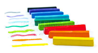 Buy stock photo A line of chalk in many colors on a white background