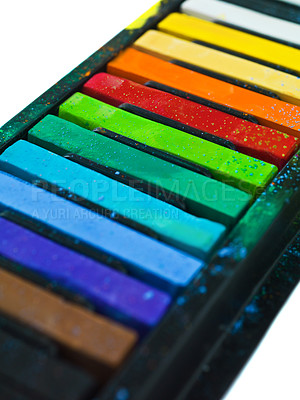 Buy stock photo Paint, pastel and artist chalk in studio for rainbow or vibrant creativity, texture and pigments for fine or visual arts. Oil or watercolor sticks, color or palette to shade or blend with composition