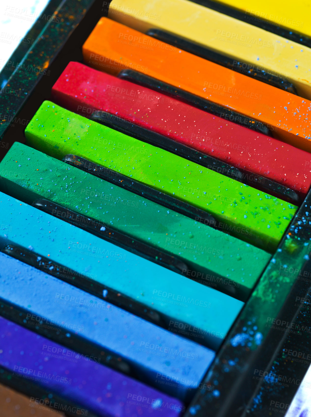Buy stock photo Paint, pastel and color chalk in studio for rainbow or vibrant creativity, texture and pigments for fine or visual arts. Oil or watercolor sticks, set or palette to shade or blend with composition.