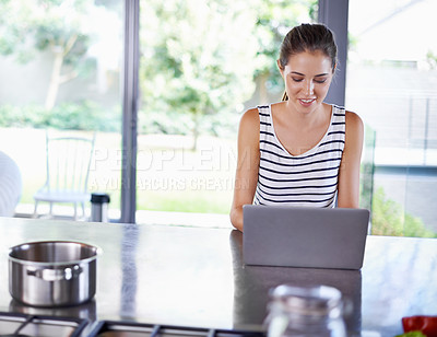Buy stock photo Online, search and woman in kitchen with laptop for cooking, research and recipe for dinner. Happy, chef and person typing on computer and learning from blog about nutrition, diet and information