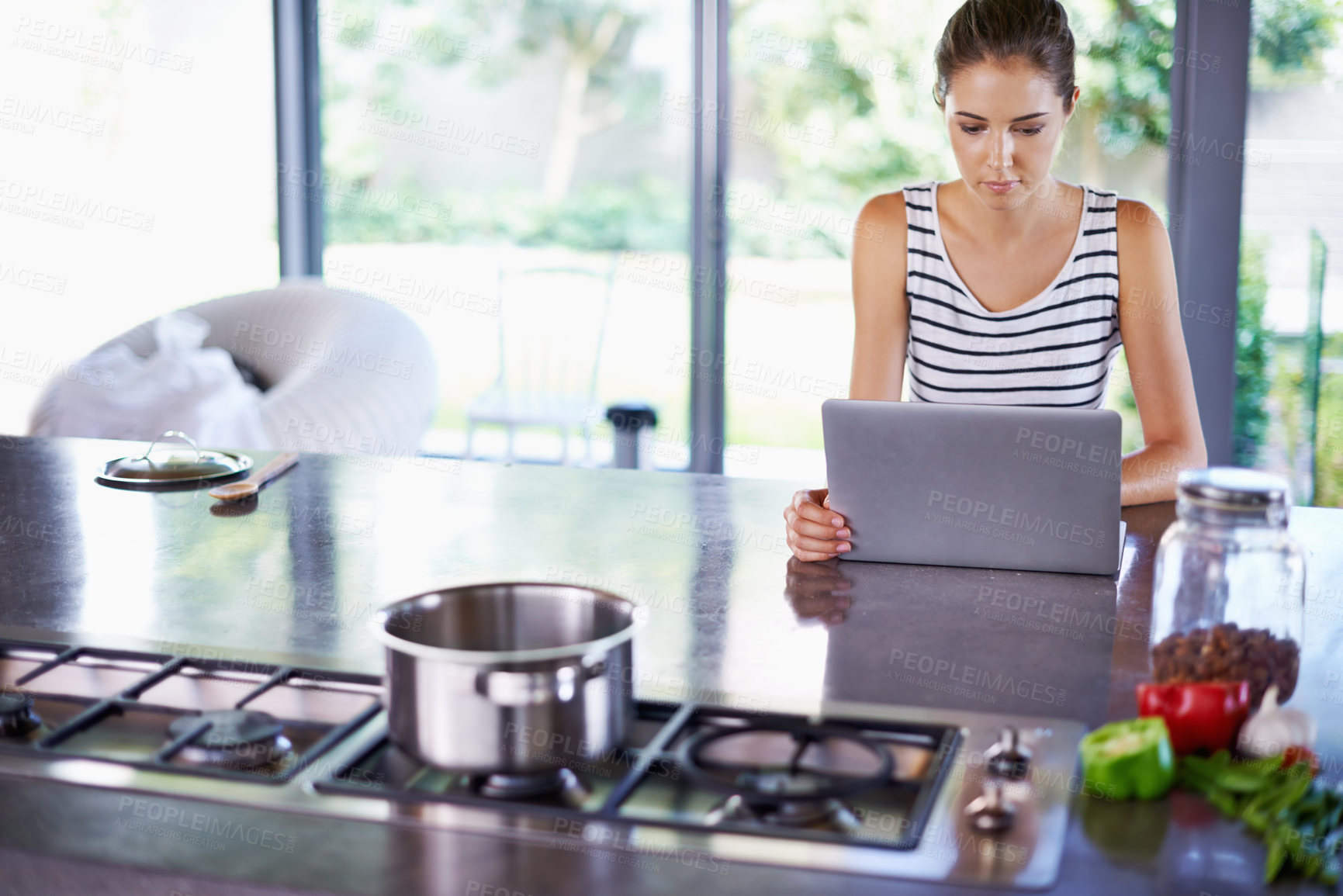 Buy stock photo Woman, kitchen and laptop for food idea, female person and home on internet. Google it, browsing cooking recipes and social media, online search with technology or thinking of healthy meal to prepare