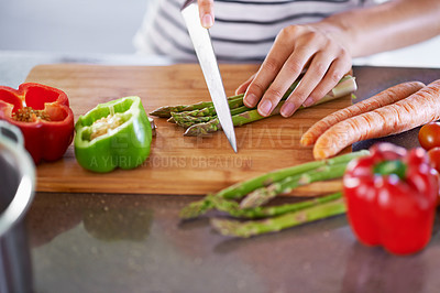 Buy stock photo Chopping, healthy and cooking in home kitchen, organic food or meal prep with fresh produce. Diet, nutrition and cutting board for wellness ingredient, pepper asparagus or carrot in vegan lunch snack