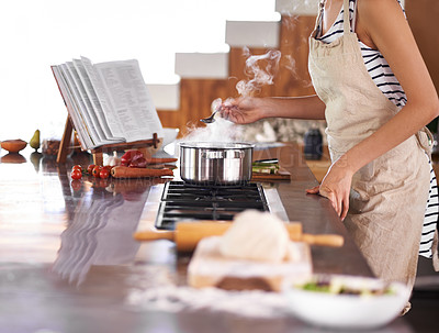 Buy stock photo Young woman cooking in a kitchen