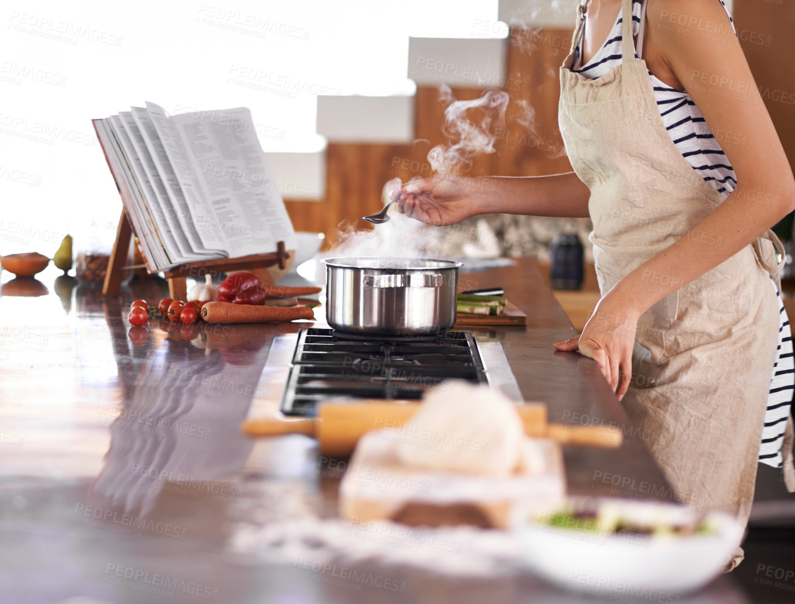 Buy stock photo Young woman cooking in a kitchen