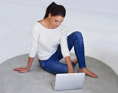 Buy stock photo Laptop, floor and woman in home for remote work, social media or reading email on internet. Computer, freelancer and person on carpet with technology for networking, communication or relax in house