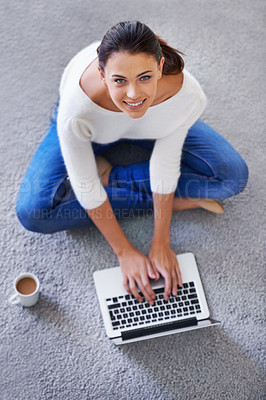 Buy stock photo Laptop, portrait and top view of happy woman typing on floor in home for remote work, social media and email on internet. Computer, above and smile of person on carpet with tech, coffee and relax