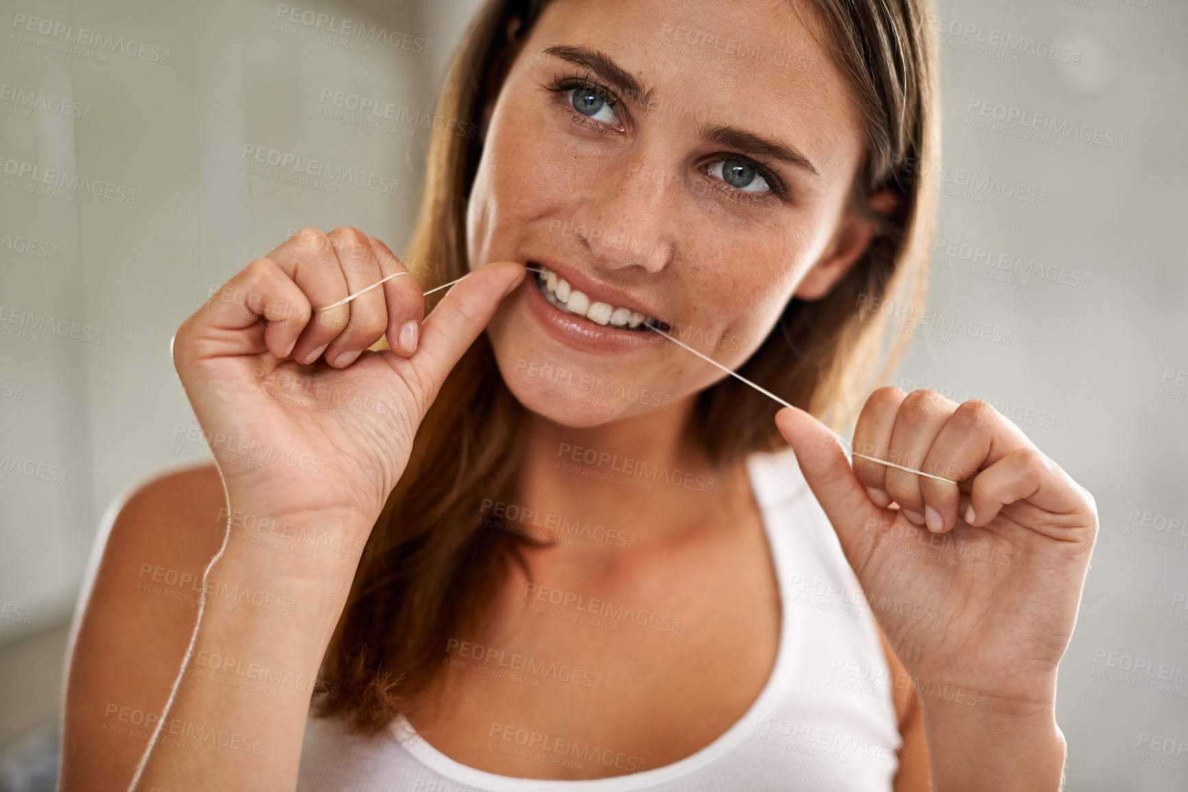 Buy stock photo Floss, teeth and happy for woman and dental for oral, health and wellness for plaque and dentistry for gum care. Young person, fresh and smile for breath, clean and mouth for results in bathroom