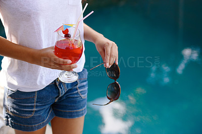 Buy stock photo Person, hands and cocktail at pool in summer on holiday or vacation with luxury hospitality at hotel. Alcohol, drink and guest relax outdoor at villa with fashion, style and sunglasses by water