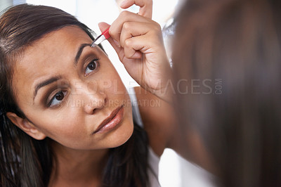 Buy stock photo Woman, tweezers or eyebrow for beauty, cosmetology or hair removal as facial, makeup or cleaning. Mirror, beautician or glow as epilation, maintenance or skincare for transformation by dermatology