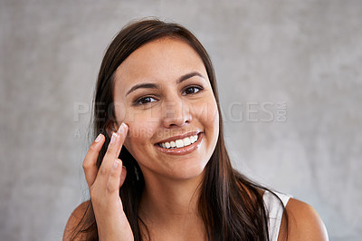 Buy stock photo Face, natural beauty and woman with smile for cosmetic care, shine and hand touching skin on grey background. Dermatology, wellness and hygiene in portrait, moisturizing facial for glow and skincare