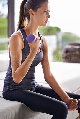 Buy stock photo Woman, fitness and dumbbells at home for health, wellness and physical training. Exercise, sitting and weights with young female person for performance workout, muscle gain and strength challenge