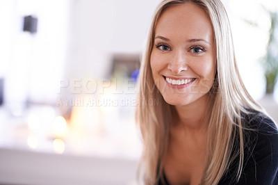 Buy stock photo Portrait of a young blonde woman relaxing at home