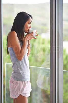Buy stock photo Woman, drinking coffee and thinking at window view in morning for weekend relaxing, thoughts or apartment. Female person, caffeine and contemplation in home for calming holiday, comfort or beverage