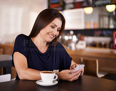 Buy stock photo Happy woman, cafe and typing with phone for communication, social media or networking at coffee shop. Female person with smile on mobile smartphone for online chatting or texting at indoor restaurant