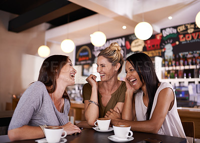 Buy stock photo Shot of three friends having fun at a coffee shop together