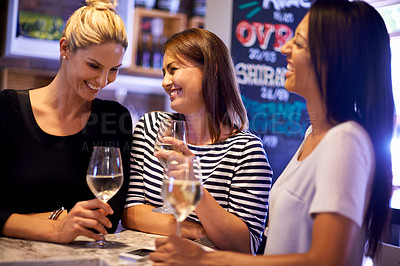 Buy stock photo A cropped shot of three woman socializing in a restaurant