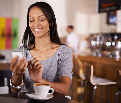 Buy stock photo Happy woman, typing and phone with coffee at cafe for social media, communication or networking. Female person with smile on mobile smartphone for online chatting, texting or app at indoor restaurant