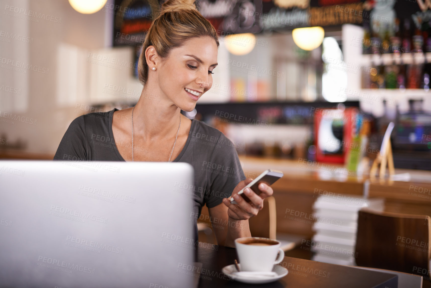 Buy stock photo Woman, reading and phone on social media in cafe and writer with remote work in restaurant. Happy, person and scroll smartphone with news, article or review coffee shop on blog, website or laptop