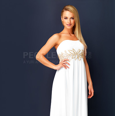 Buy stock photo Beautiful woman in a white gala dress and looking gorgeous for prom, orcars or red carpet event. Portrait a fashion and beauty model looking posh in a designer gown with copy space background