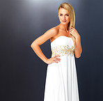 Pretty female in white prom style evening dress