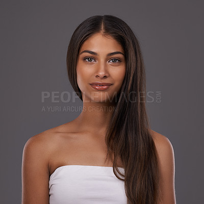 Buy stock photo Hair care, portrait and woman with beauty, skincare or shine isolated on a gray studio background. Hairstyle, cosmetics or face of Indian model in makeup at salon for treatment or glow at hairdresser