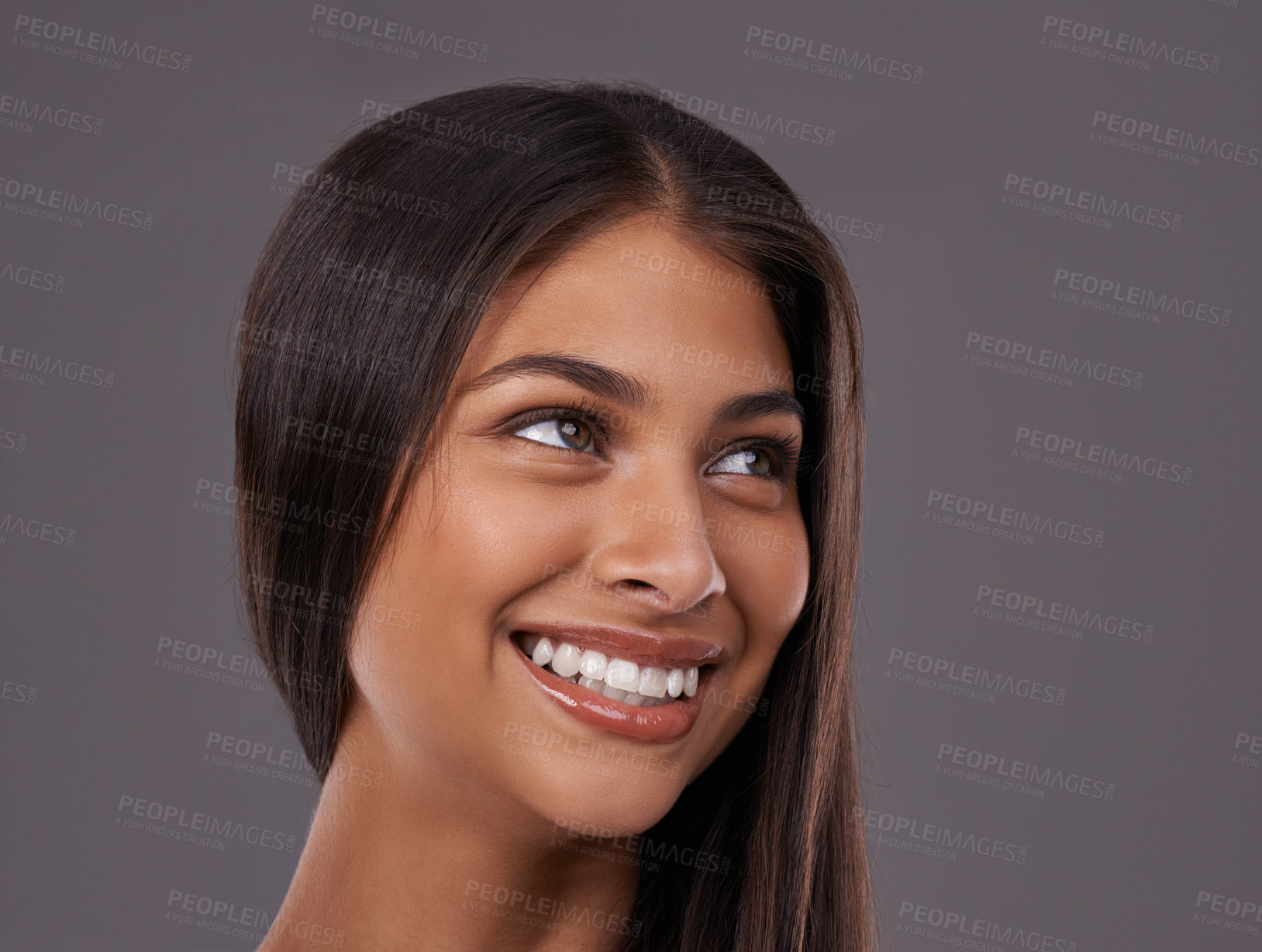 Buy stock photo Thinking, hair and face of happy woman on gray background for healthy texture, wellness and beauty. Smile, hairdresser and person with long hairstyle for salon products, cosmetics and shine in studio