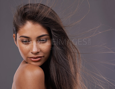 Buy stock photo Wind, face and woman for hair care, treatment and blow dry isolated on studio background. Female person, hairdo and hairstyle for shampoo, hairdressing and cosmetology with closeup and natural shine