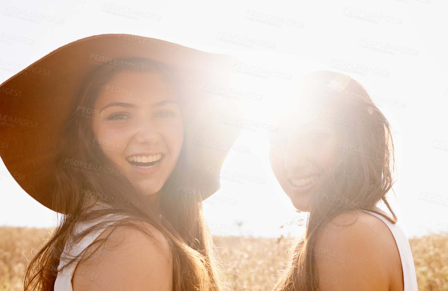 Buy stock photo Portrait, lens flare or field with women, friends or smile with journey or countryside with adventure. Face, girls or people with weekend break or nature with vacation, sunshine or happy with summer