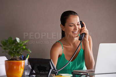 Buy stock photo Phone call, remote work and landline with woman secretary in office for communication or reception. Laptop, smile and happy young receptionist answering telephone for small business or startup