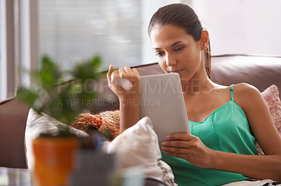 Buy stock photo Tablet, search and calm woman on a sofa with social media, scroll or reading ebook at home. Digital, relax and female person in a living room with streaming movie app, google it or Netflix and chill
