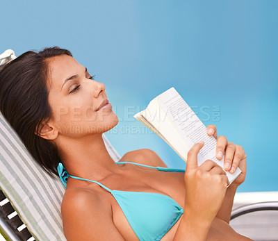 Buy stock photo Woman, bikini and swimming pool relax with book for holiday vacation at hotel accommodation, summer or resting. Female person, swimwear and reading in Hawaii for travel resort, tanning or peaceful