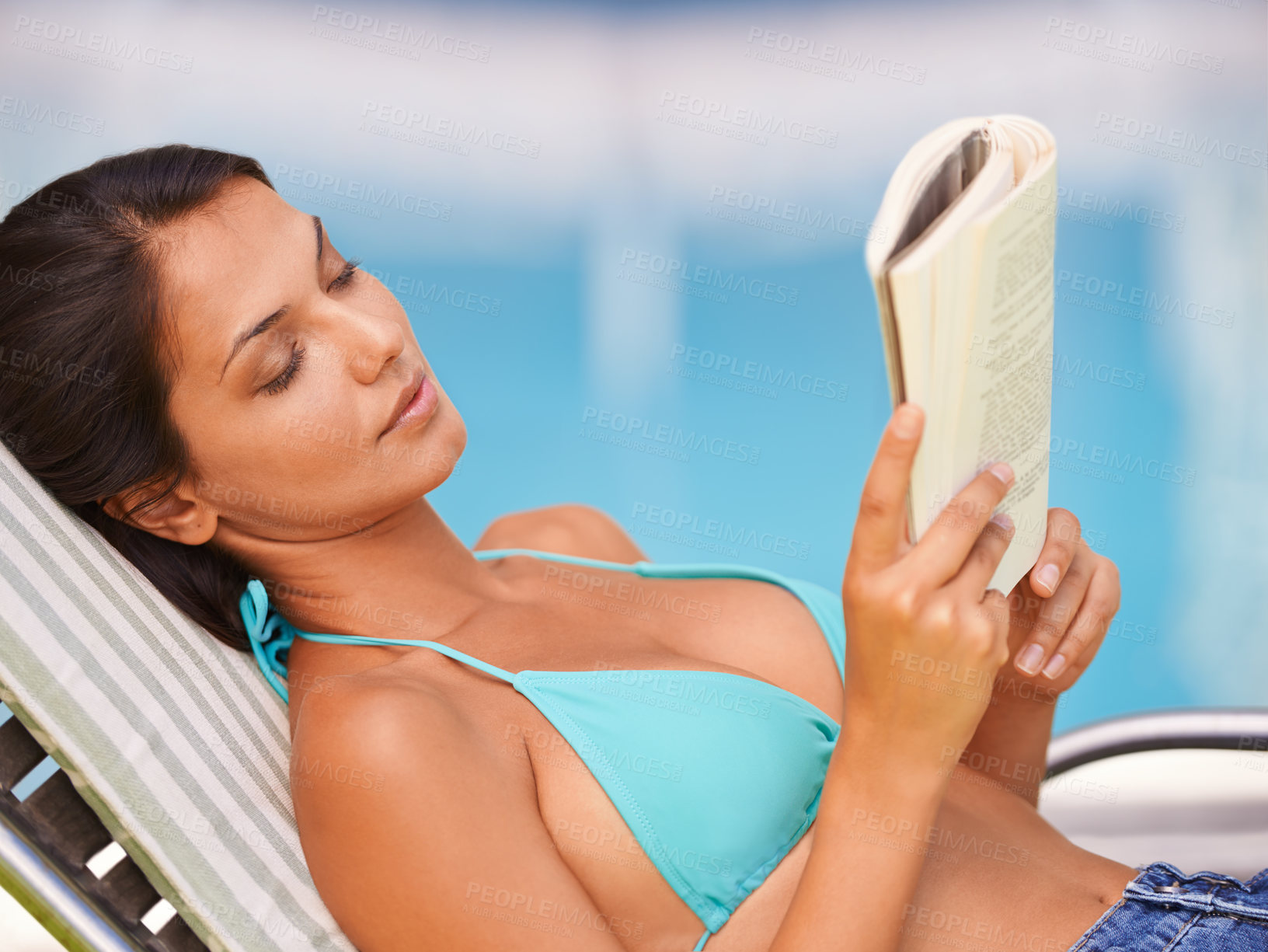 Buy stock photo Woman, bikini and swimming pool relax or reading book for holiday vacation at hotel accommodation, summer or resting. Female person, swimwear and Hawaii trip for travel resort, tanning or peaceful
