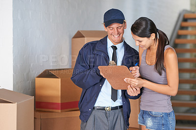 Buy stock photo Cropped shot of a beautiful woman receiving a delivery