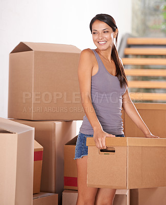 Buy stock photo Smile, young woman and packing boxes for new home owner or parcels for logistics and client moving house. Freight, cargo and lady at property with a package from a courier or shipping for real estate